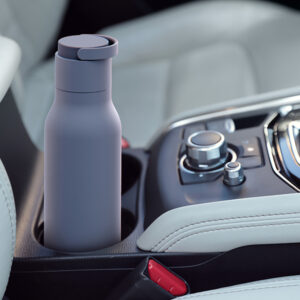 Silver thermos in holder inside of car
